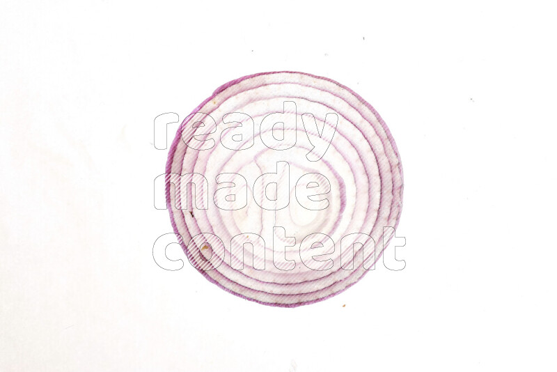 Onion slices on illuminated white background