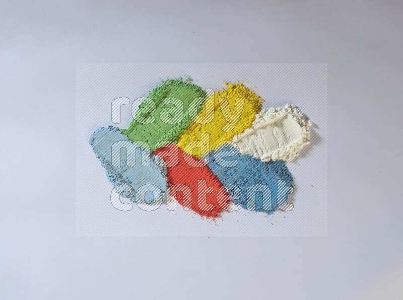 Multicolored powder smears on white background