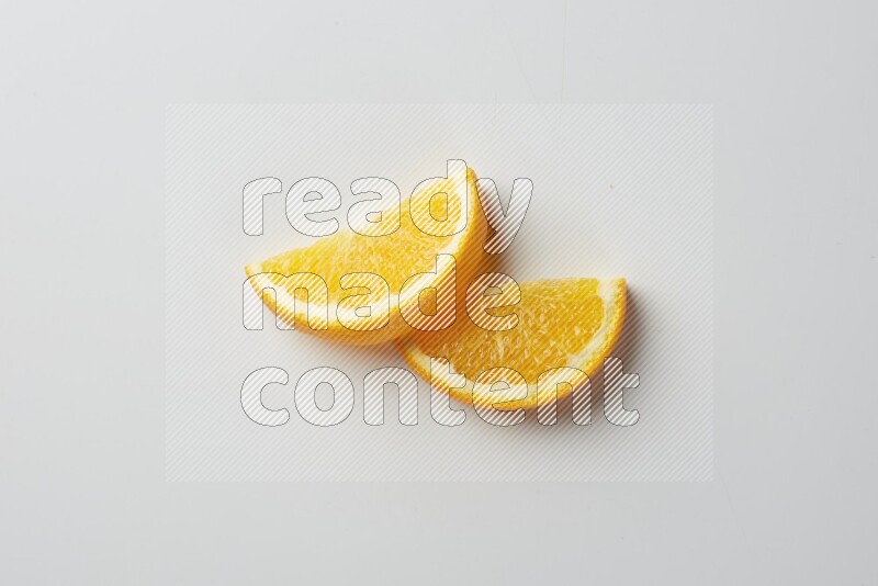 Two halves of an orange slices on white background