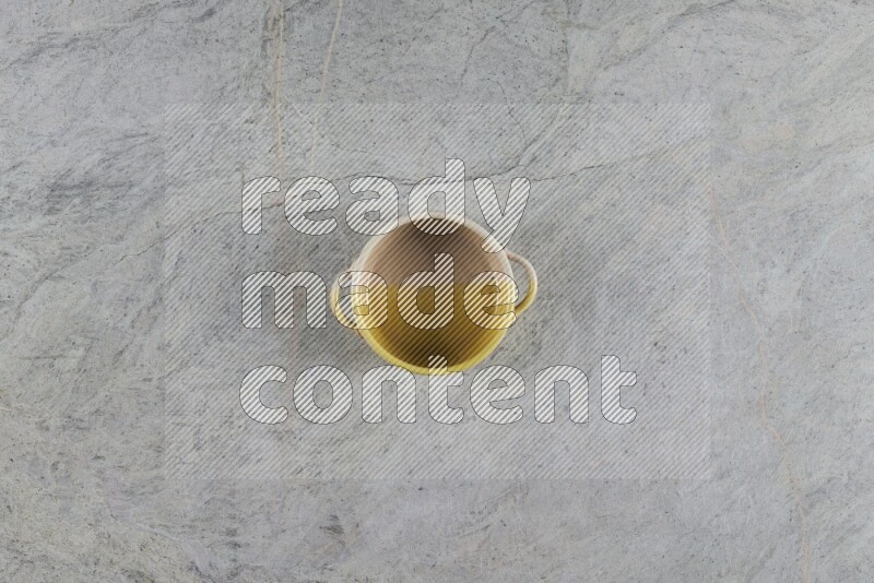A multicolored pottery Bowl on grey marble background