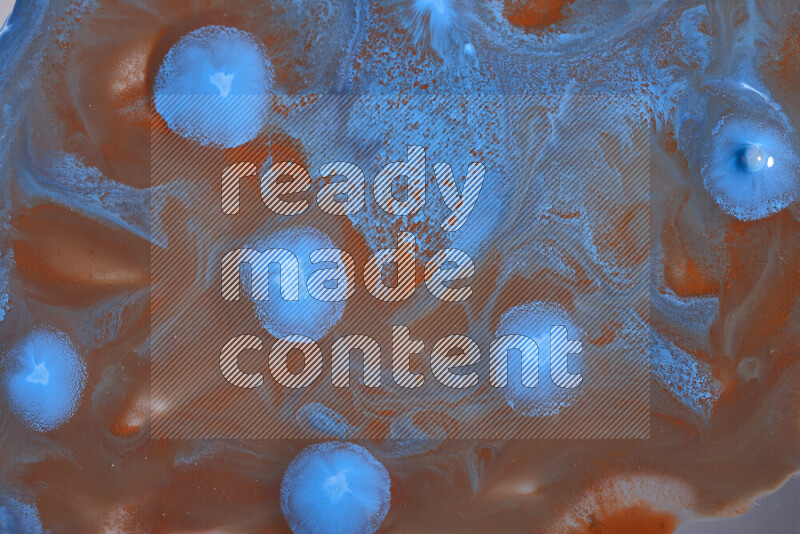 Abstract colorful background with mixed of orange and blue paint colors