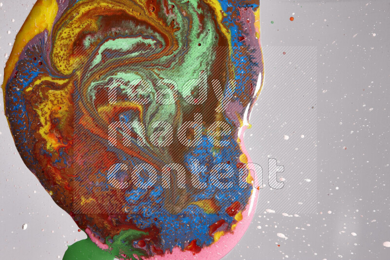 Close-ups of assorted colors blending on a grey background