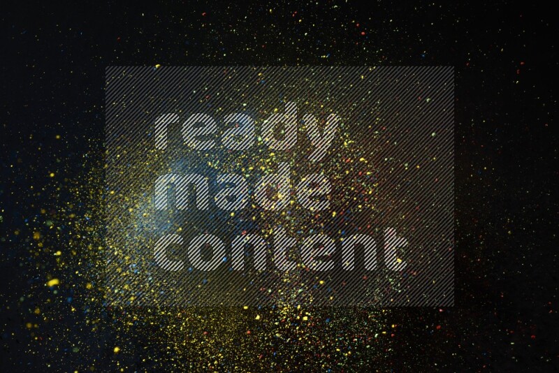Colorful powder explosion on black background