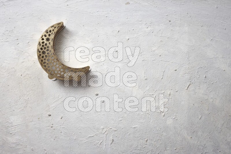 Nuts in a wooden bowl with a lantern in a light setup