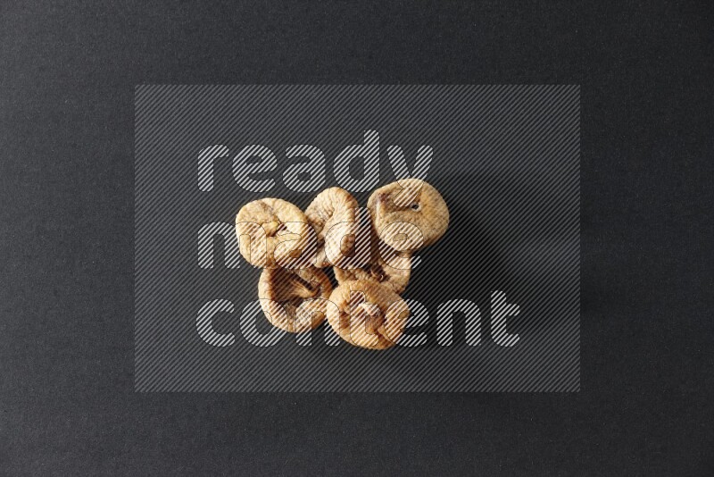 Dried figs on a black background in different angles