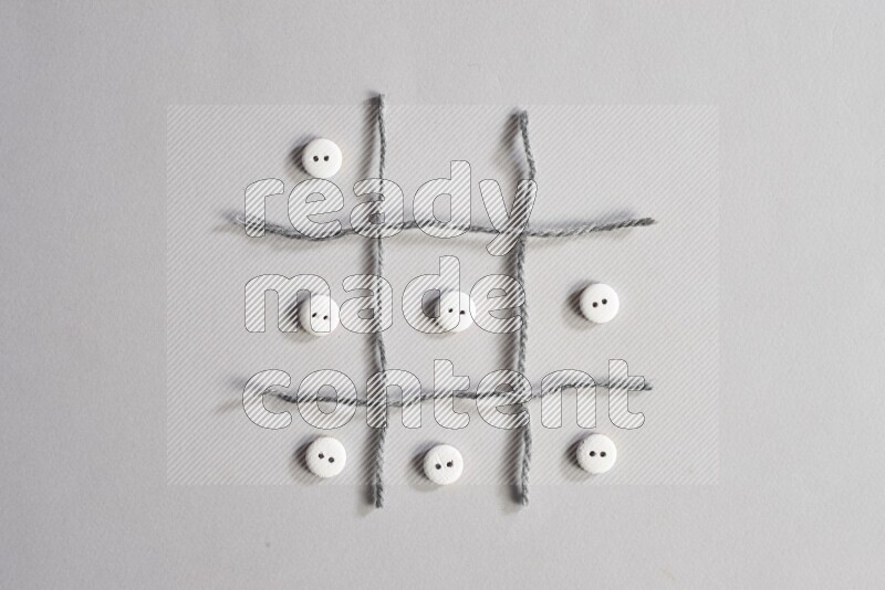 White buttons placed on grey background