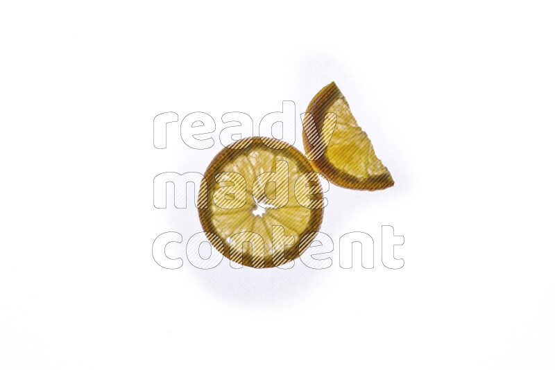 Orange slices on illuminated white background