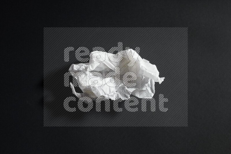 White paper sheet on black background