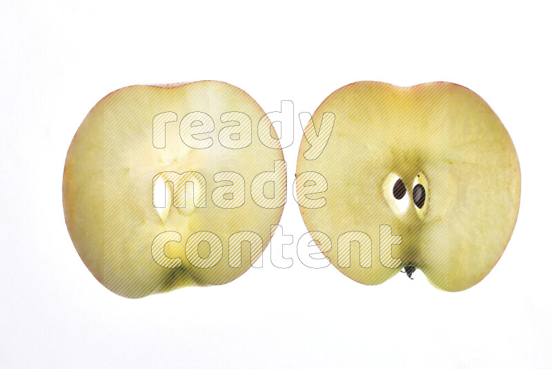 Apple slices on illuminated white background