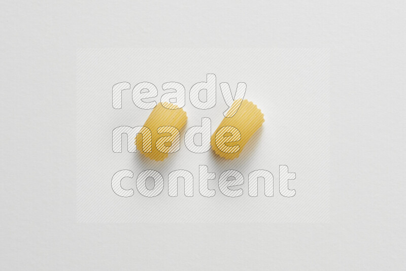Elbow pasta on white background