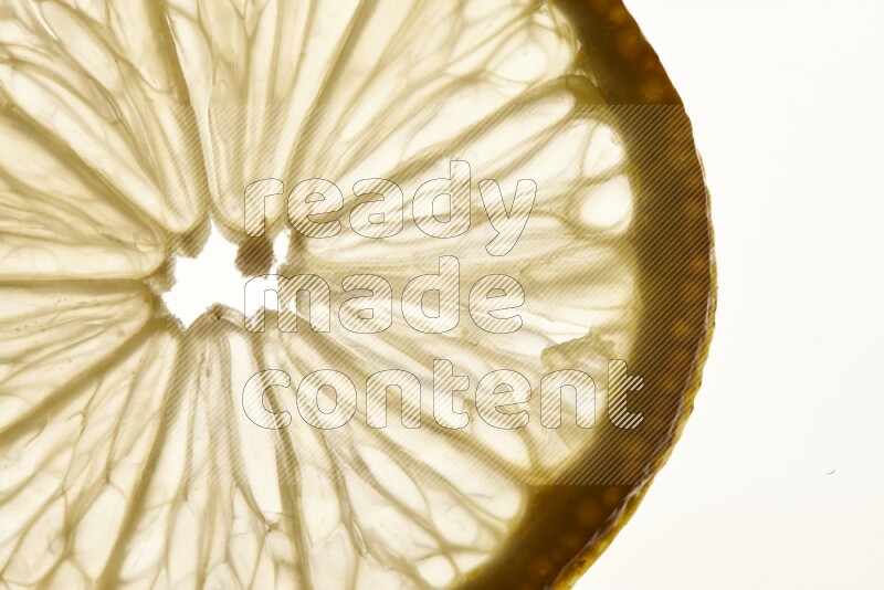 Lemon slices on illuminated white background