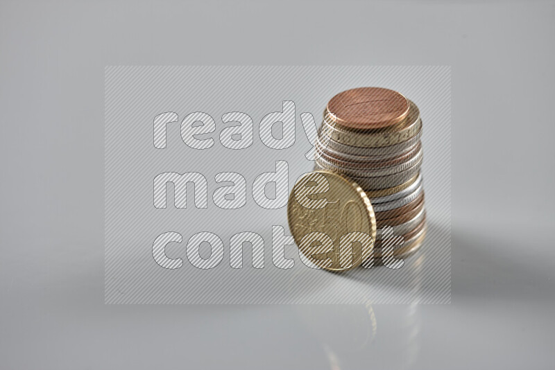 Random old coins on grey background