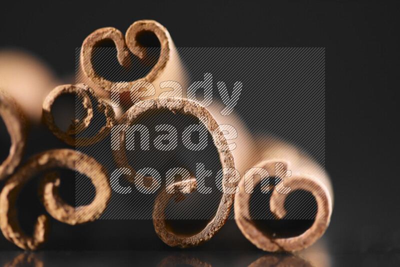 Cinnamon sticks on black background