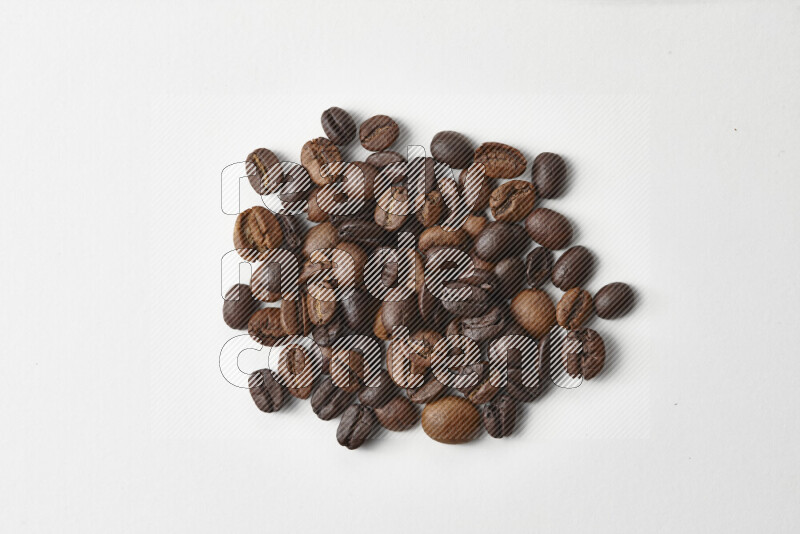 Roasted coffee beans on white background