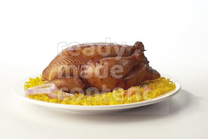 yellow  basmati Rice with  whole roasted chicken on a white rounded plate direct on white background