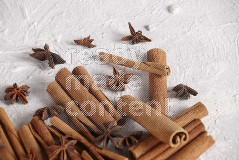 cinnamon sticks with star anise on white background