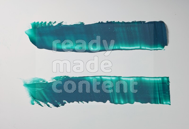 Turquoise painting knife strokes on white background