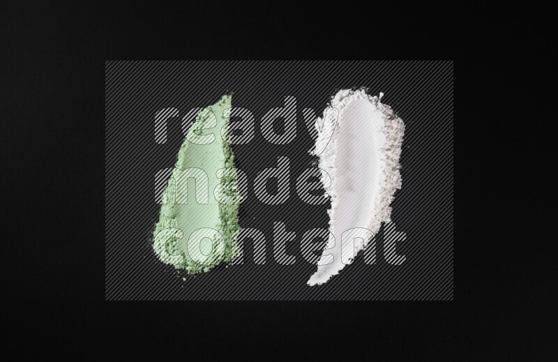 Multicolored powder smears on black background