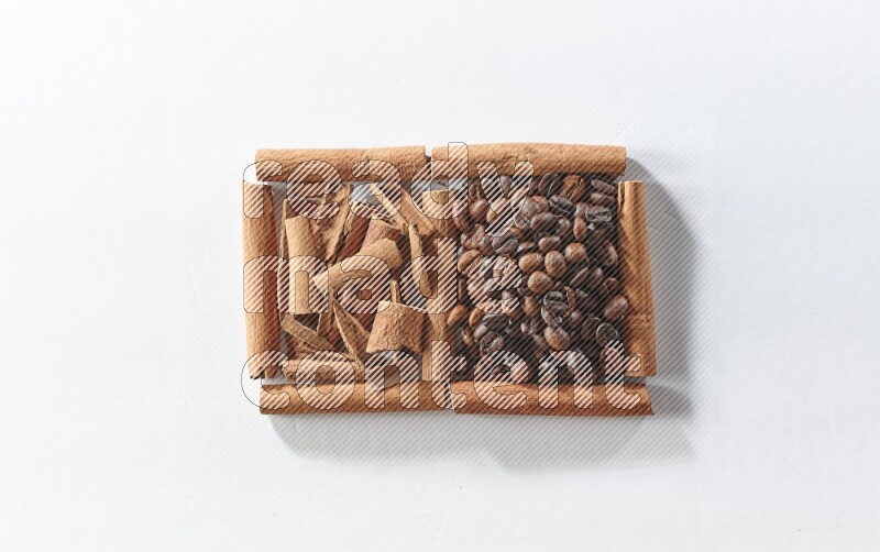 2 squares of cinnamon sticks full of coffee beans and cinnamon on white flooring