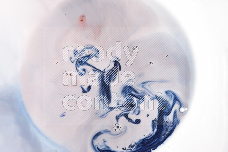 A close-up of abstract swirling patterns in blue, red and white