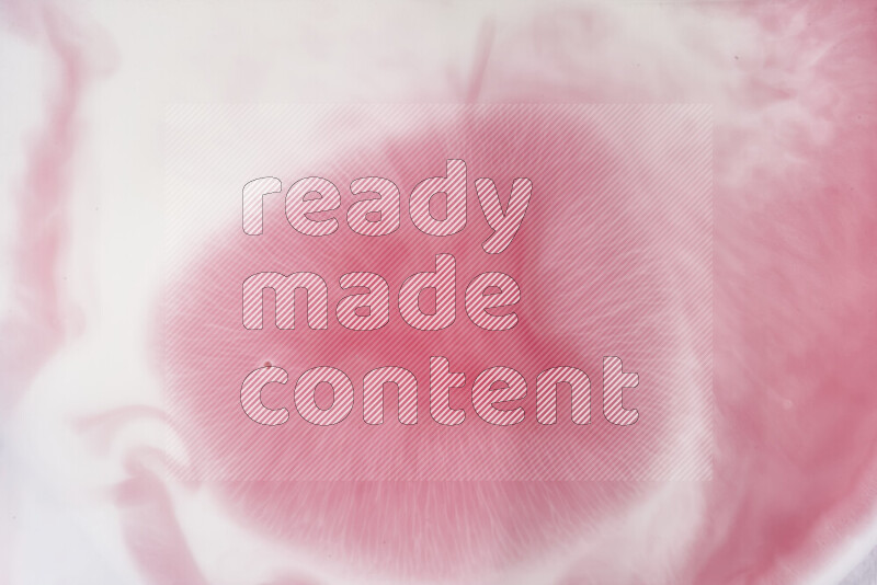 A close-up of abstract swirling patterns in red and white