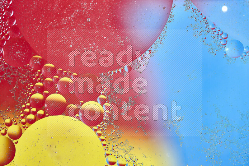 Close-ups of abstract oil bubbles on water surface in shades of yellow, red and blue