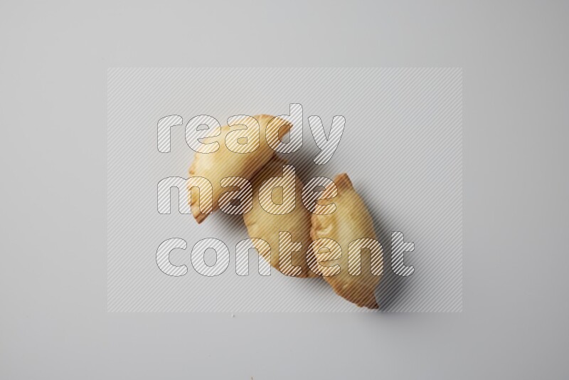 Three fried sambosa from a top angle on a white background