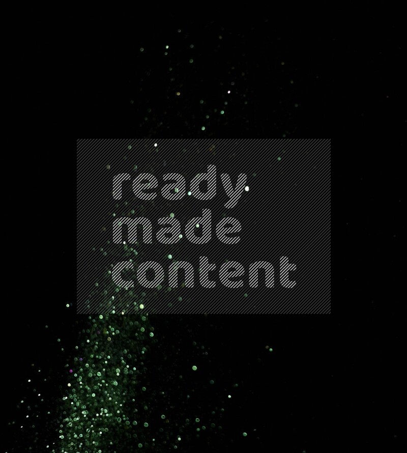 Green glitter powder isolated on black background