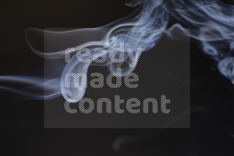 Motion of wavy smoke isolated on dark background