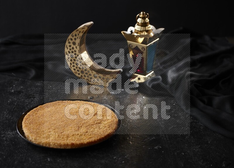 Konafa with lanterns in a dark setup