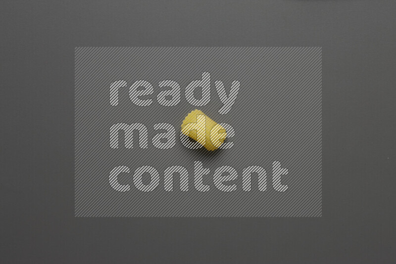 Elbow pasta on grey background