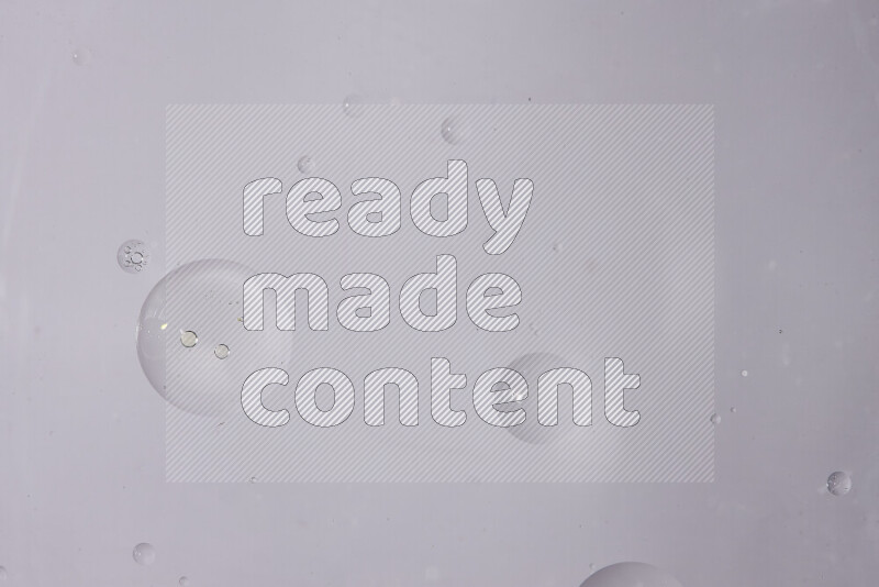 Abstract oil droplets in a water surface on white background