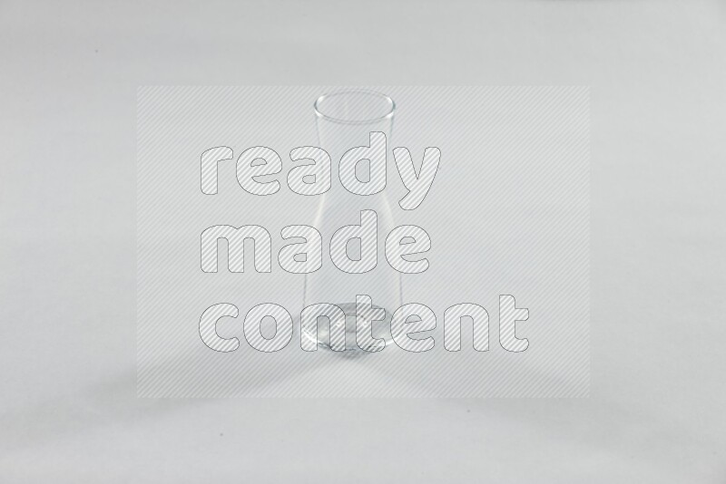 Glassware such as coffee pot, cup, saucer and jar on white background