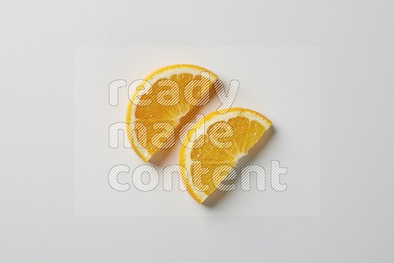 Two halves of an orange slices on white background
