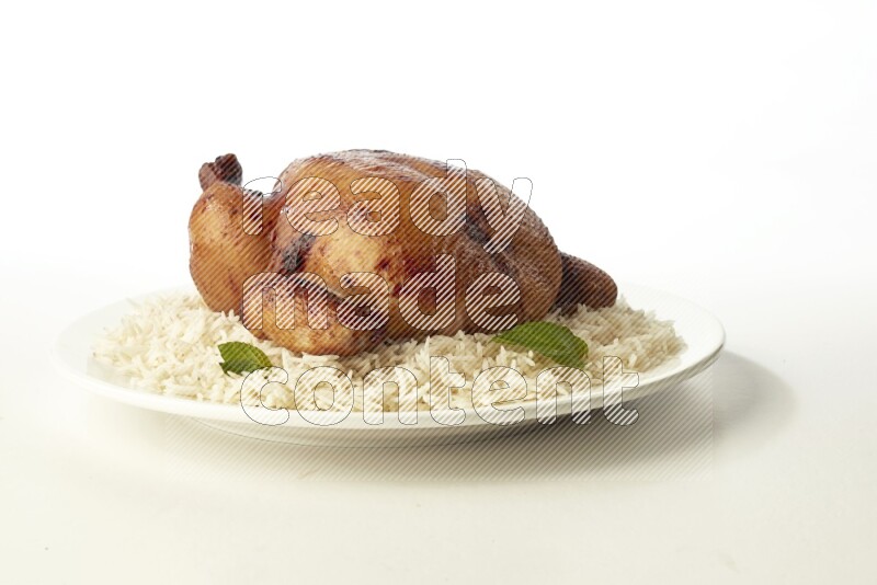 white  basmati Rice with  whole roasted chicken  on a white rounded plate direct on white background