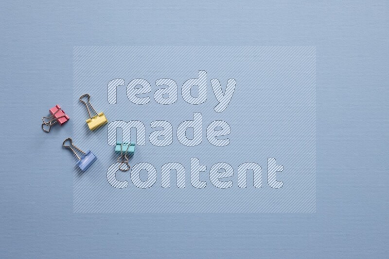 Different school supplies on blue background