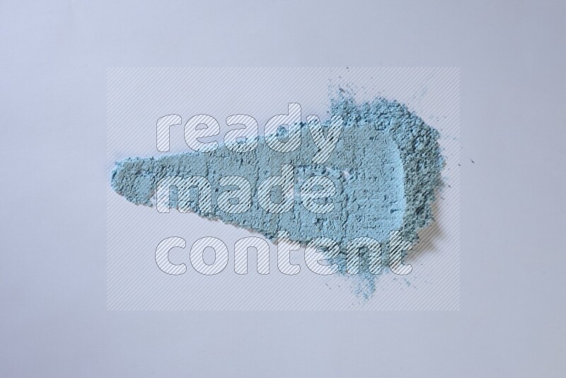 Blue powder smears on white background