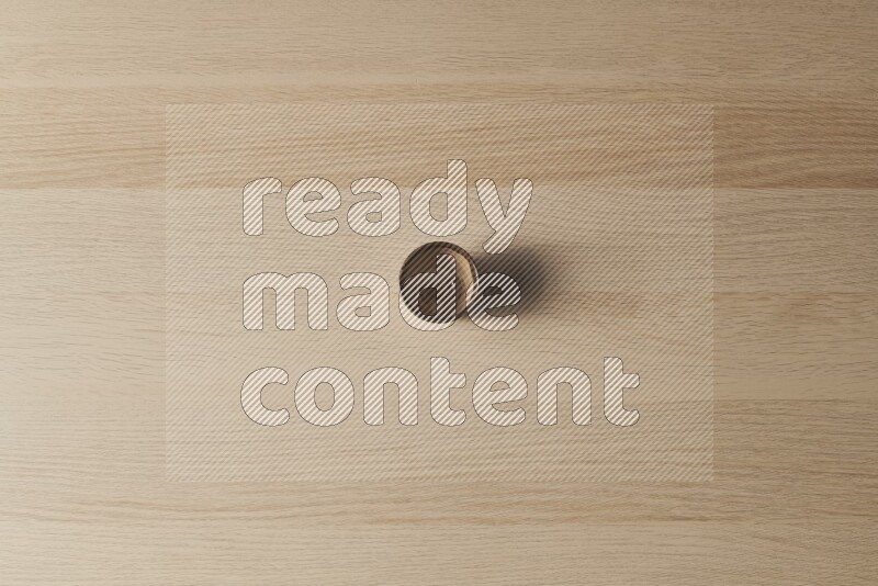 A pottery cup on light wooden background