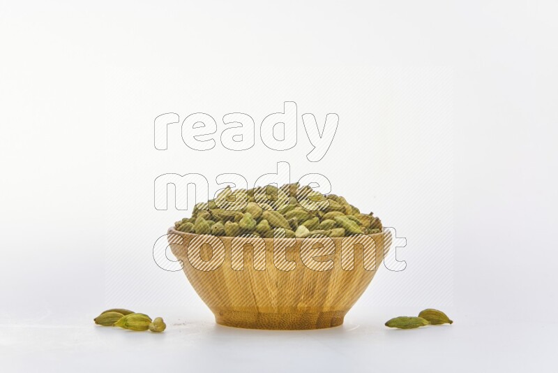 Cardamon in a container on white background