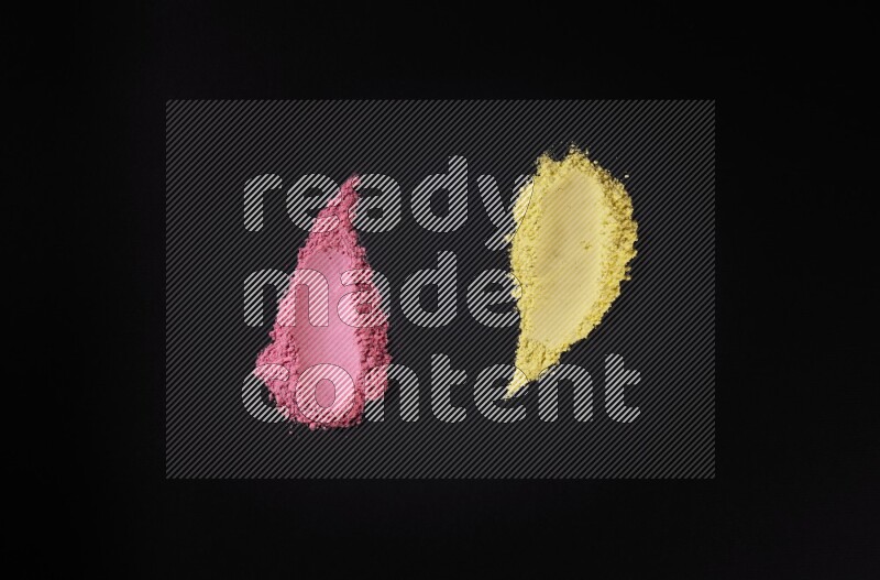 Multicolored powder smears on black background