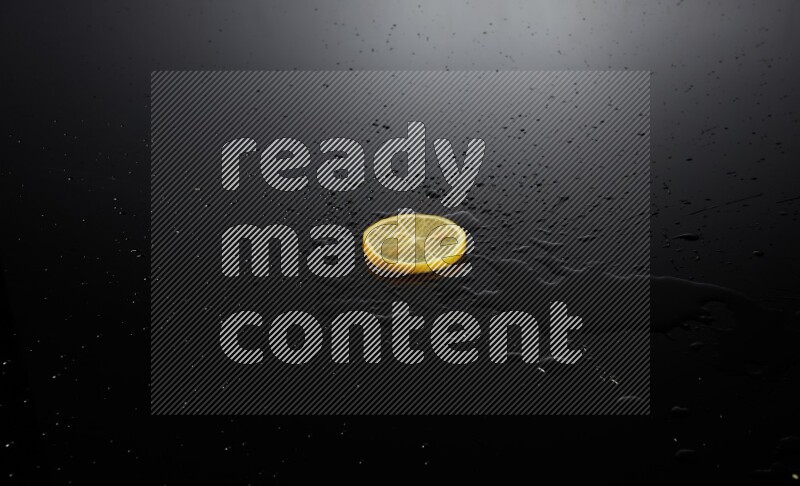 Lemon slice on black background