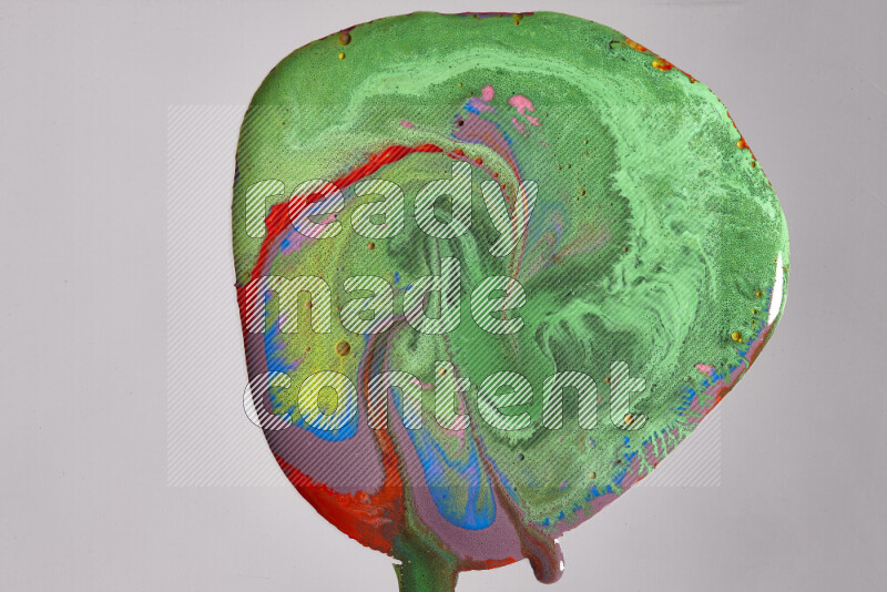 Close-ups of assorted colors blending on a grey background