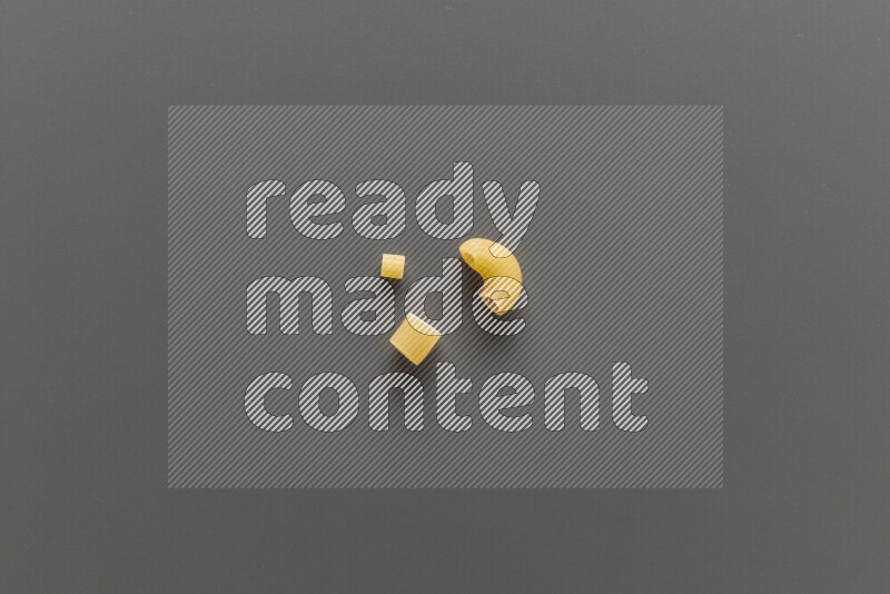Different pasta types on grey background