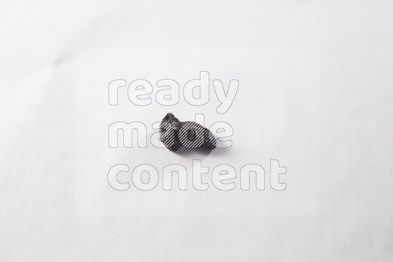 Dried plums on white background