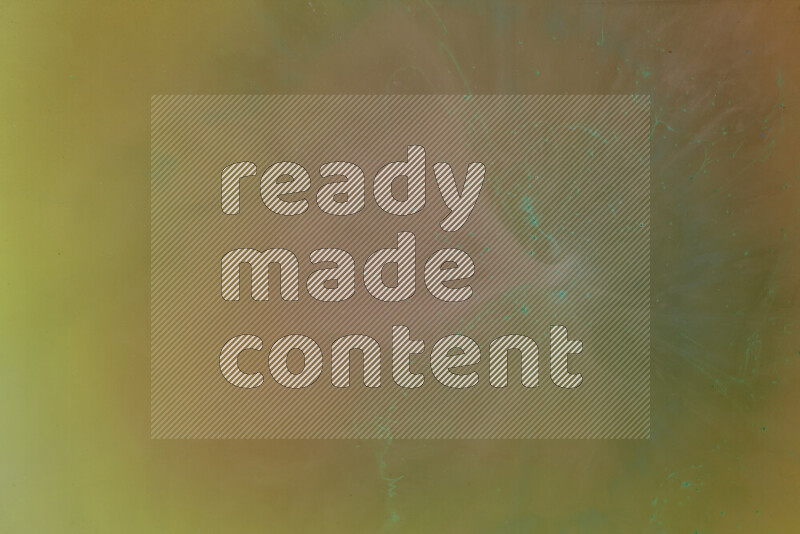 The image captures a dramatic splatter of green paint over a orange backdrop