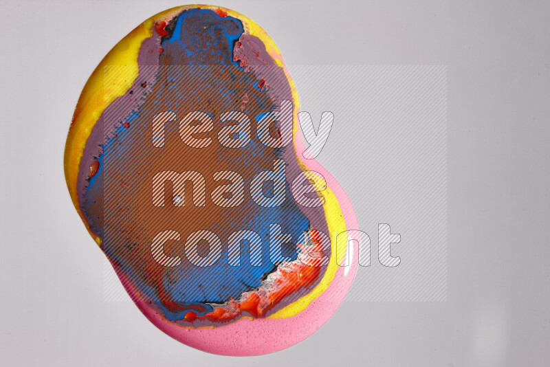 Close-ups of assorted colors blending on a grey background