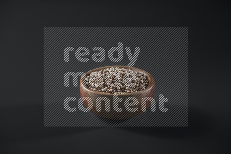 Black-eyed peas in a wooden bowl on grey background