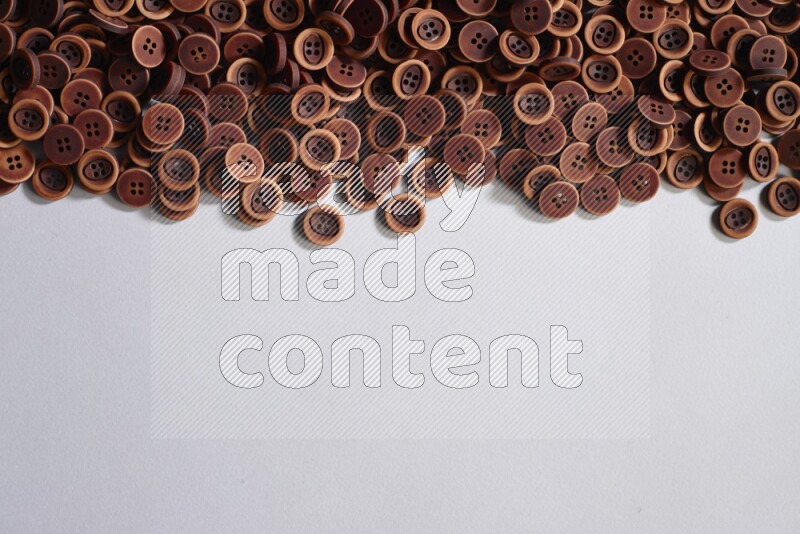 Wooden buttons placed on grey background