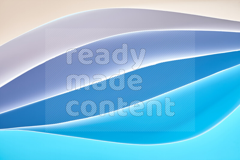 This image showcases an abstract paper art composition with paper curves in blue gradients created by colored light