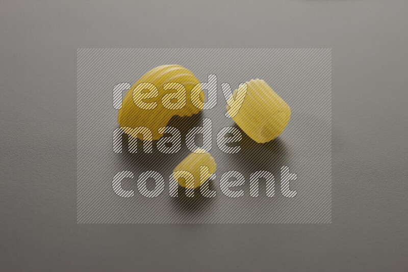 Different pasta types on grey background
